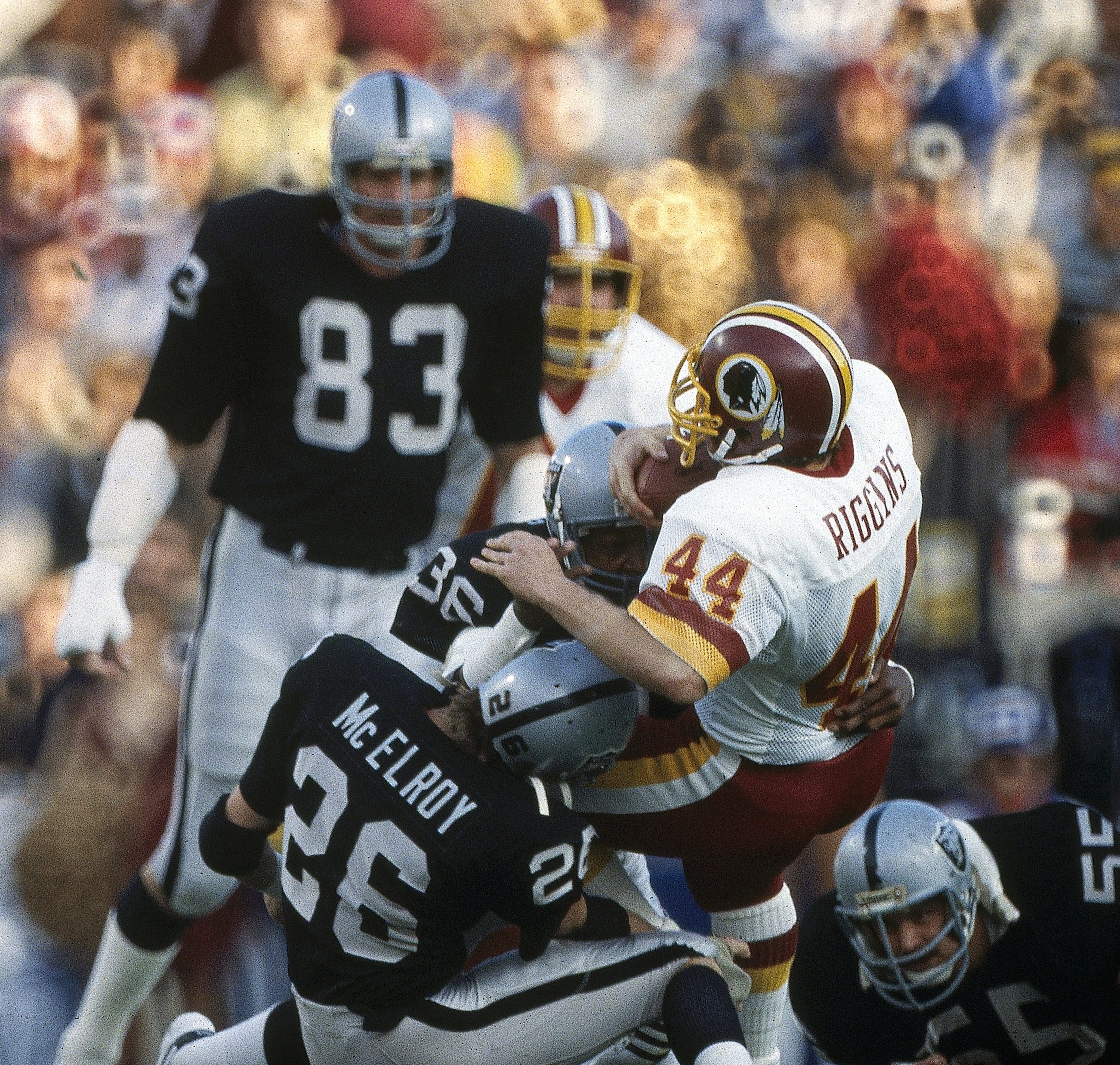 Football: Super Bowl XVIII: Washington Redskins John Riggins (44) in action vs Los Angeles Raiders Vann McElroy (26) at Tampa Stadium. Tampa, FL 1/22/1984 CREDIT: Andy Hayt (Photo by Andy Hayt /Sports Illustrated/Getty Images) (Set Number: X29570 TK1 )