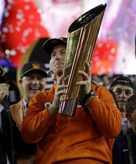 Clemson head coach Dabo Swinney holds the championship trophy after the NCAA college football playoff championship game against Alabama Tuesday, Jan. 10, 2017, in Tampa, Fla. Clemson won 35-31. (AP Photo/David J. Phillip)